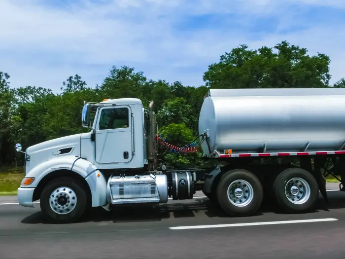 American style truck on freeway road at day